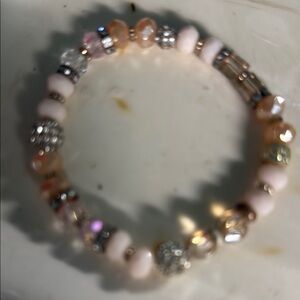 Elegant Cream and Gold Beaded Bracelet with Intricate Spacers